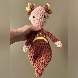 Handcrafted crochet doll with knotted gown